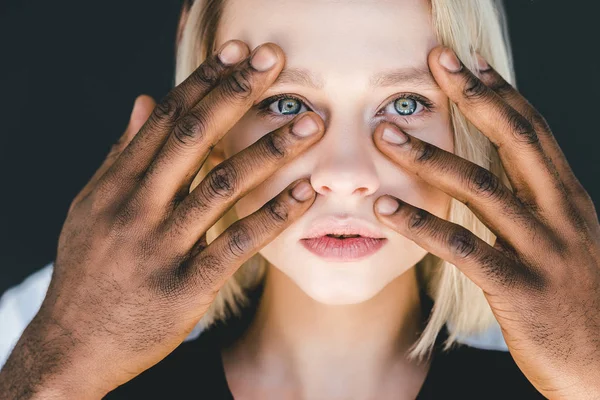 Cropped image of african american boyfriend touching blonde girlfriend face isolated on black — Stock Photo