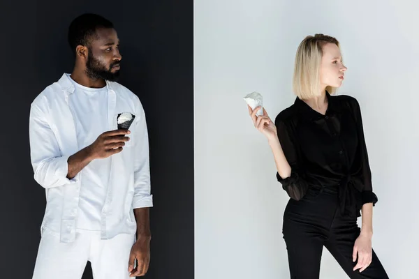 African american boyfriend and blonde girlfriend standing with ice cream cones — Stock Photo