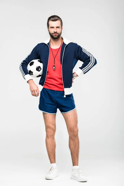 Treinador de futebol com apito e bola, isolado em branco — Fotografia de Stock