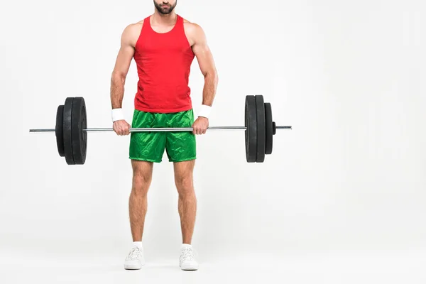 Cropped view of sportsman in retro sportswear holding barbell, isolated on white — Stock Photo