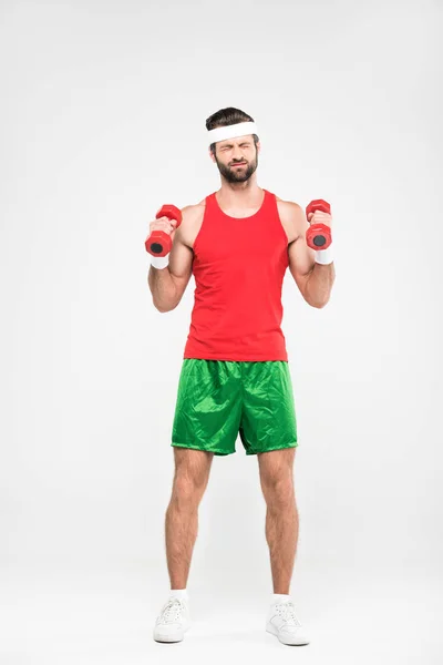 Sportsman in retro sportswear training with dumbbells, isolated on white — Stock Photo