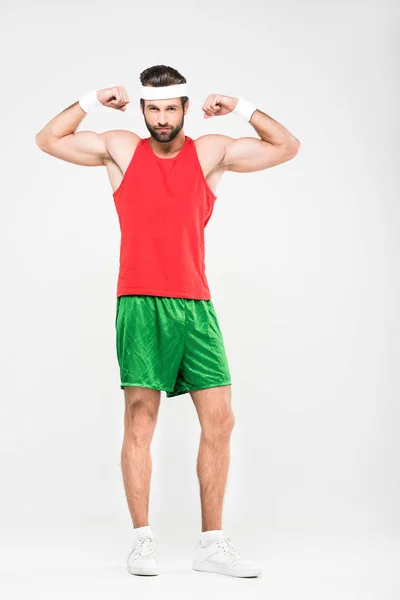 Sportsman in retro sportswear showing muscles, isolated on white — Stock Photo