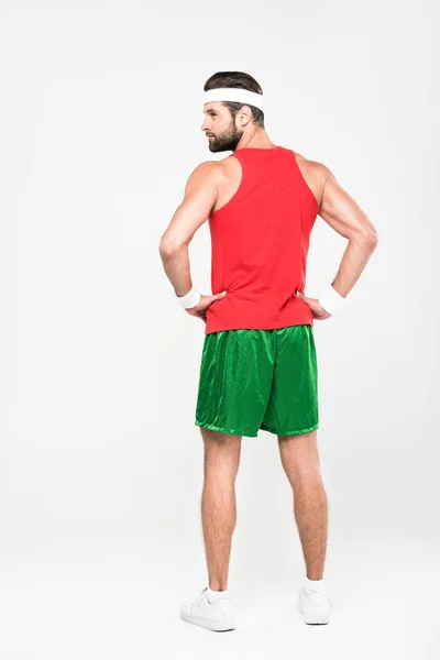 Rear view of sportsman posing in retro sportswear, isolated on white — Stock Photo