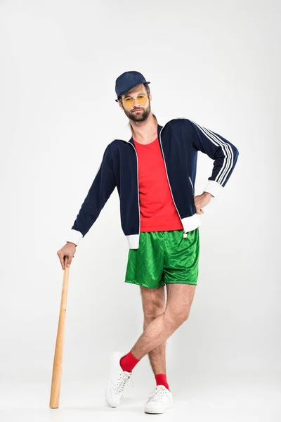 Retro baseball player posing in cap with baseball bat, isolated on white — Stock Photo