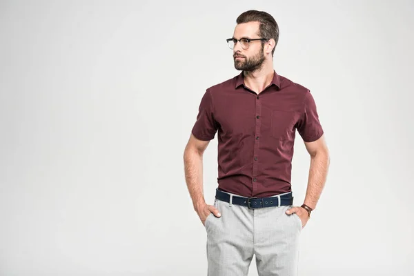 Handsome serious man posing in casual closing and glasses, isolated on grey — Stock Photo