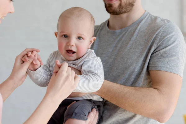 Cropped view of parents with little son — Stock Photo