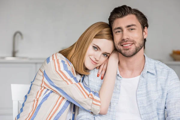 Young attractive woman laying on boyfriend shoulder — Stock Photo