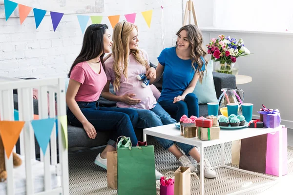 Multicultural friends and pregnant woman having fun at baby-party — Stock Photo