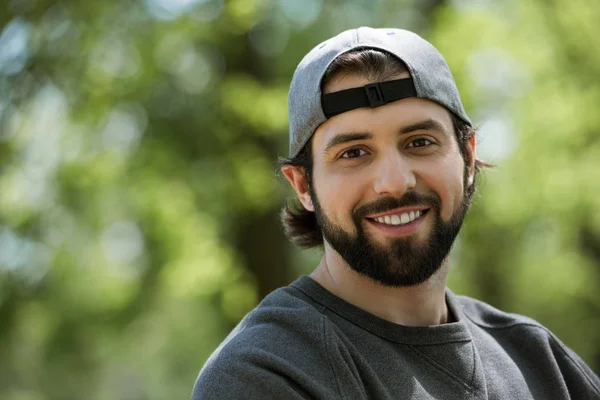 Portrait of smiling man on blurred background — Stock Photo