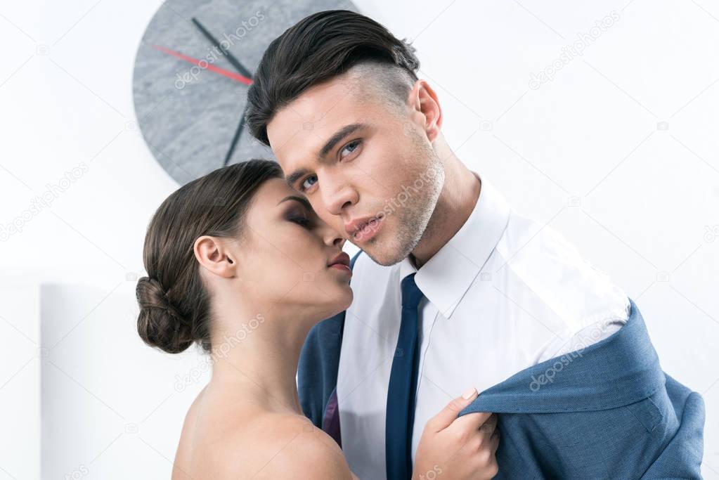 sensual business colleagues in foreplay at office