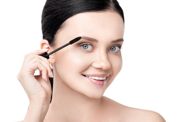 woman applying mascara