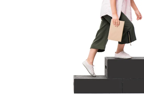 Schoolchild with book on podium — Stock Photo, Image