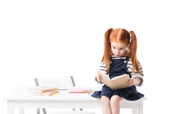 Schoolgirl reading book — Stock Photo, Image