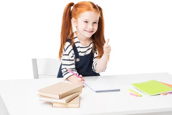 Schoolmeisje tekening in notebook — Stockfoto