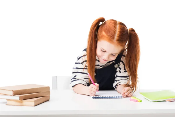 Schoolgirl drawing in notebook — Stock Photo, Image