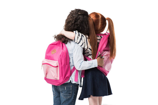 multiethnic schoolgirls with backpacks