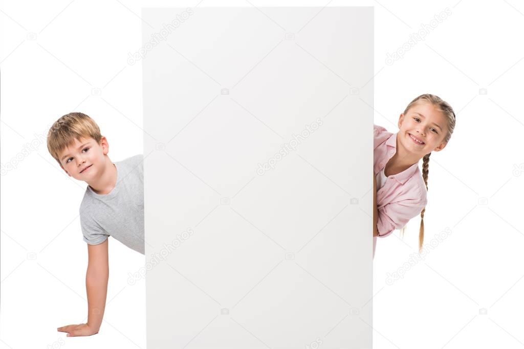 boy and girl with blank banner
