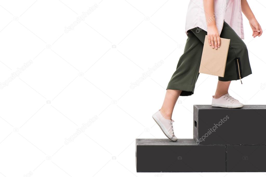 schoolchild with book on podium