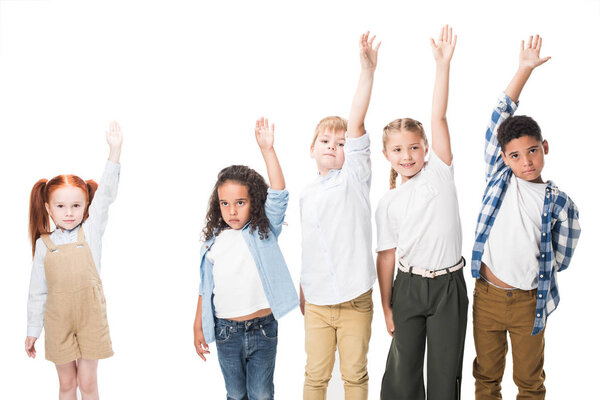 multiethnic children raising hands