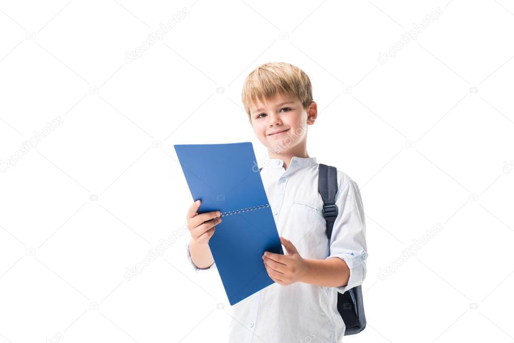 schoolboy holding notebook