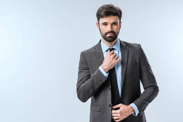 Businessman tying necktie — Stock Photo, Image