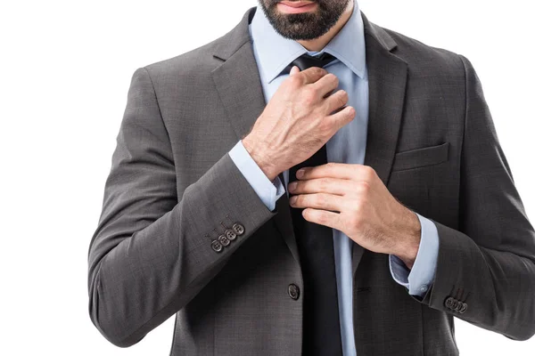 Businessman tying necktie — Stock Photo, Image