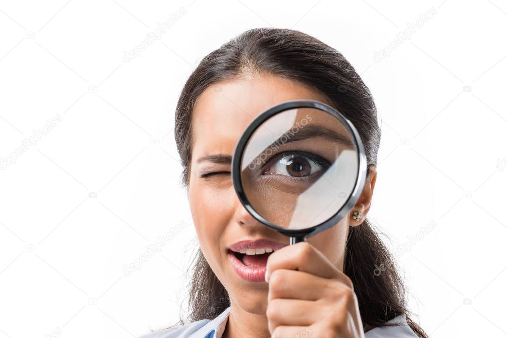 businesswoman holding magnifying glass