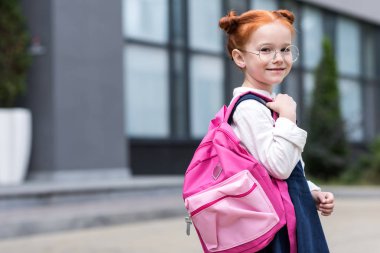 redhead schoolgirl with backpack