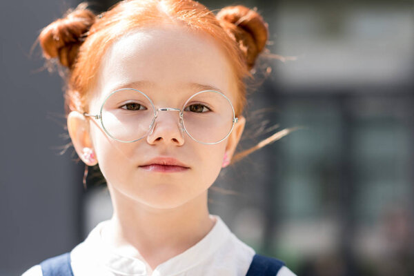 redhead girl in eyeglasses