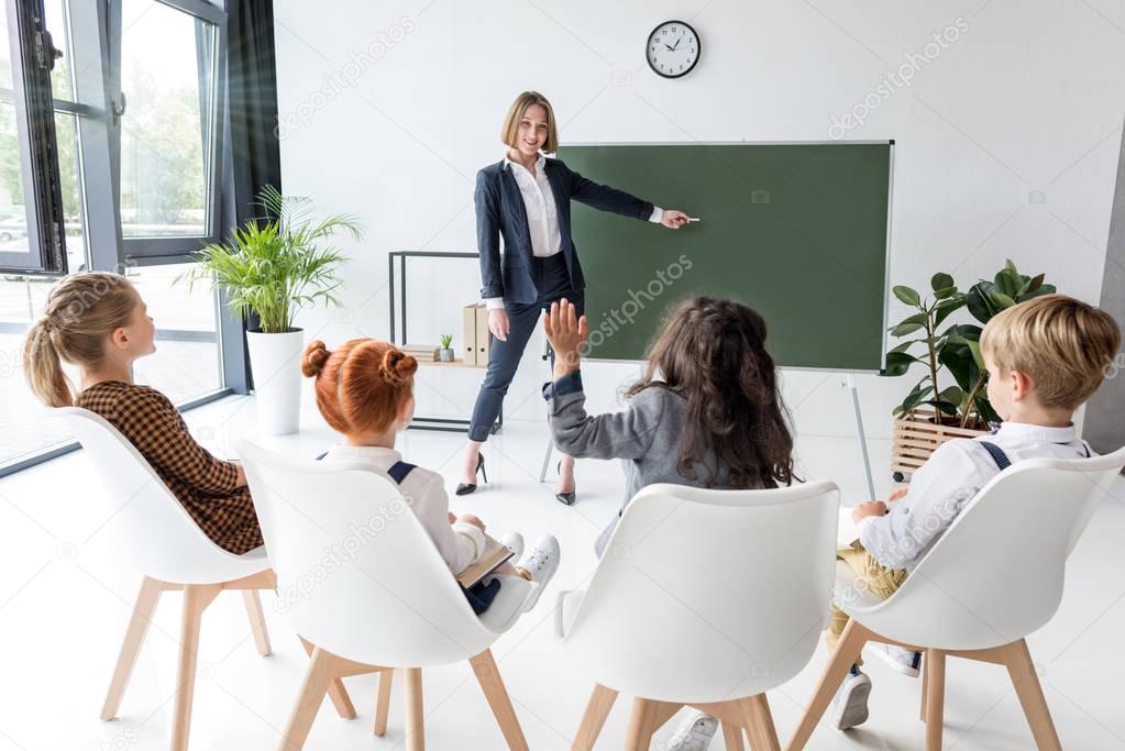 teacher explaining lesson to students 