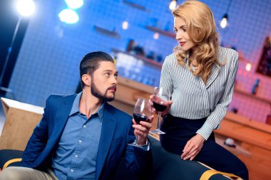 man and woman drinking wine clipart