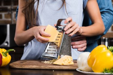 woman grating cheese clipart