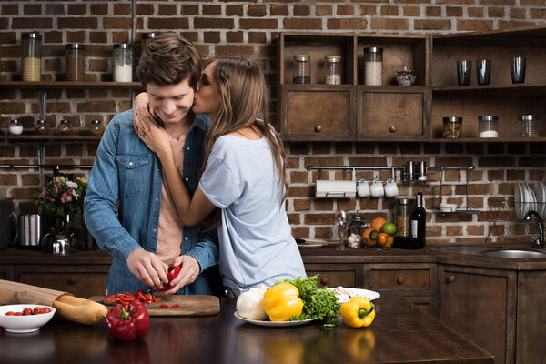 couple preparing dinner at home