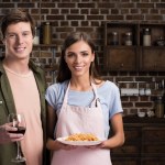 Couple with dinner in hands