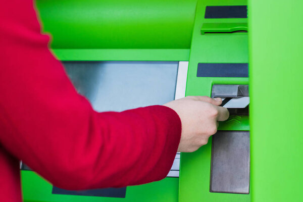 putting credit card into atm