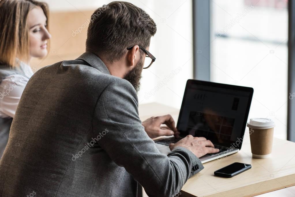 businesspeople having conversation in cafe