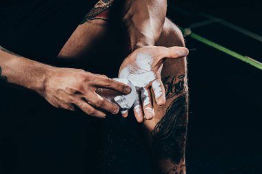 sportsman applying talcum to hands clipart