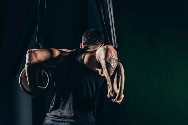 Sportsman on gymnastic rings — Stock Photo, Image