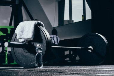 Barbell on floor in gym clipart