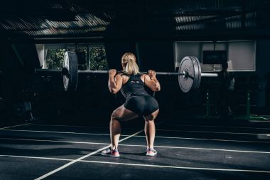 sportswoman lifting barbell clipart
