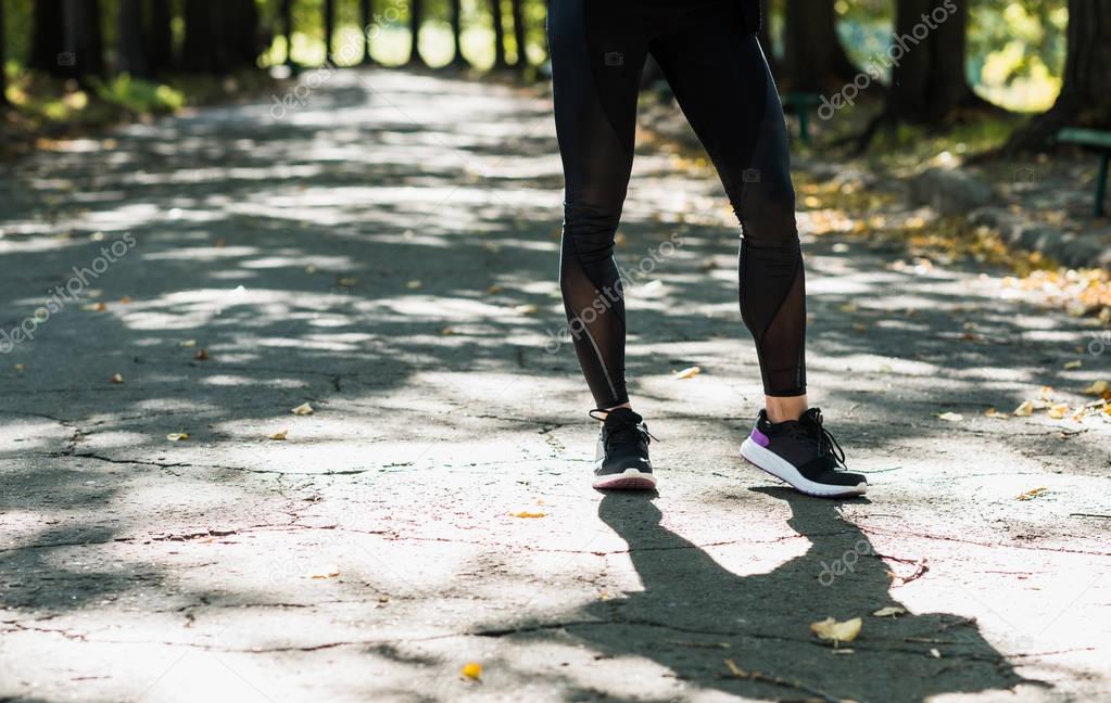 woman in sportswear at autumn park