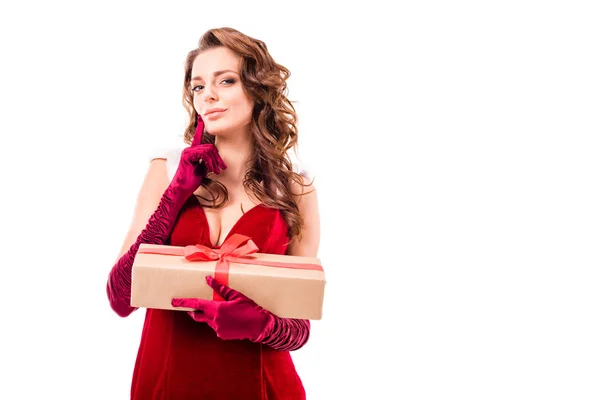 Chica pensativa en traje de santa con regalo — Foto de Stock