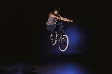 bmx cyclist performing stunt clipart