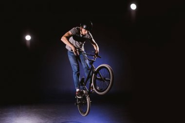 bmx cyclist performing stunt clipart
