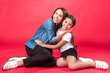 Daughter and mother hugging each other clipart