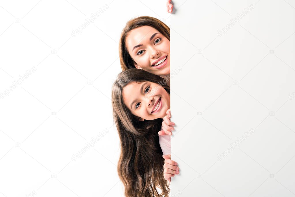 Mother and daughter looking out from board