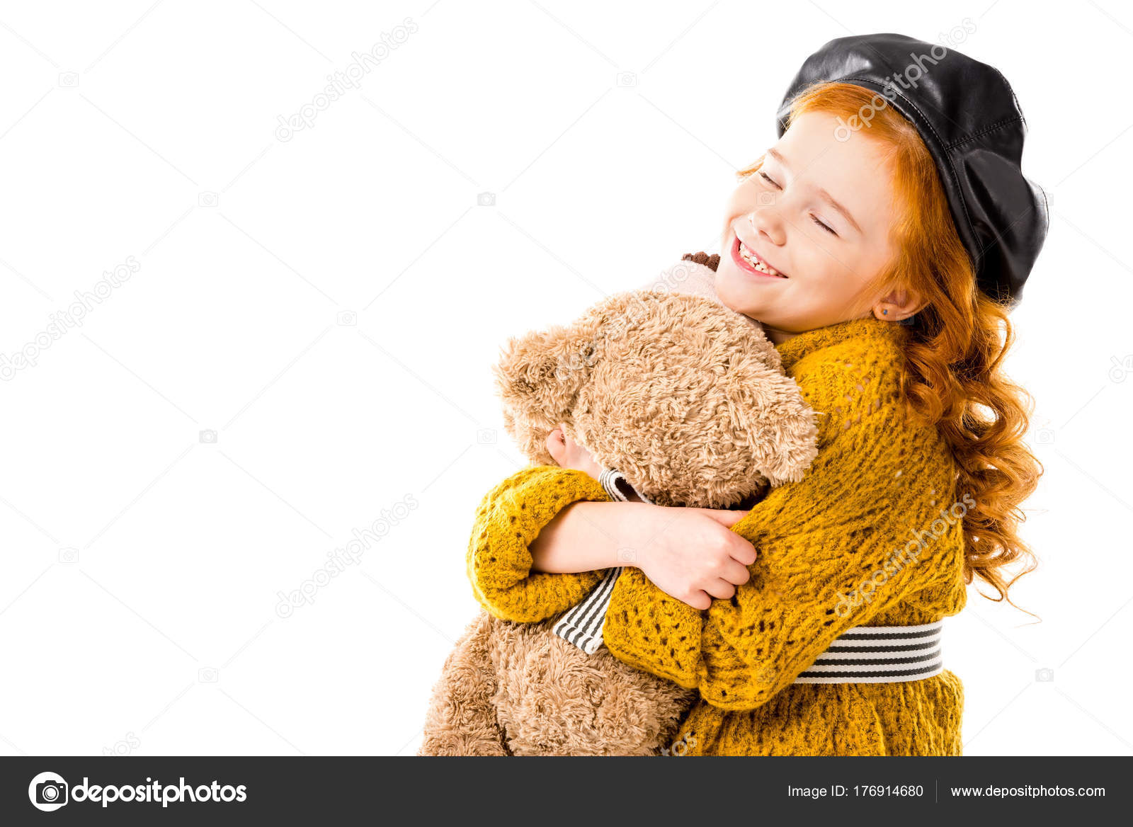 kid hugging teddy bear