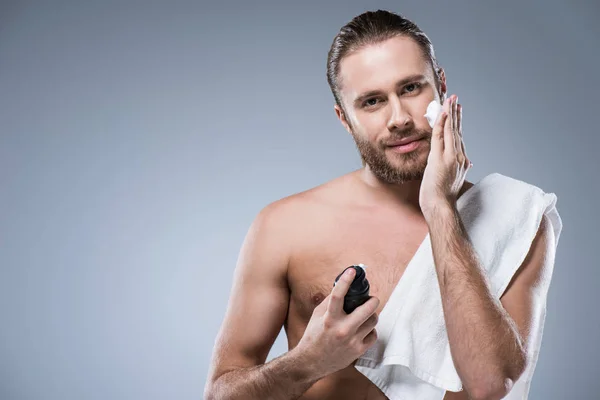Smiling Young Man Bottle Hand Towel Shoulder Applying Shaving Foam — Stock Photo, Image