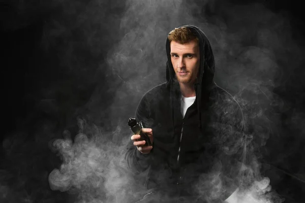Young Bearded Man Smoking Electronic Cigarette Surrounded Clouds Steam — Free Stock Photo