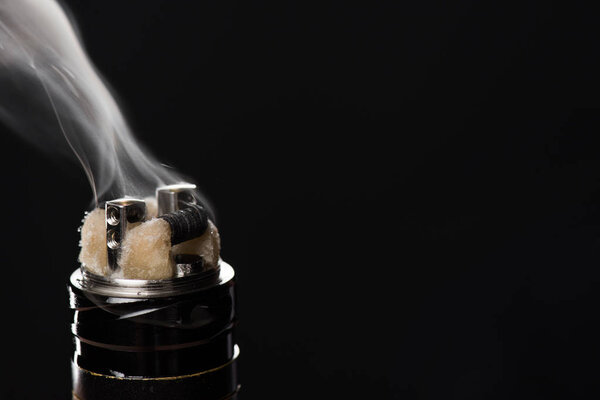Activating electronic cigarette isolated on black background